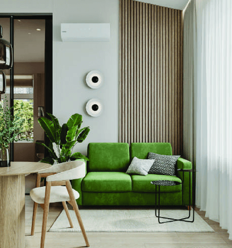 Living-room visualisation with a green sofa, wood slat wall, side table and wall-mounted air conditioner.
